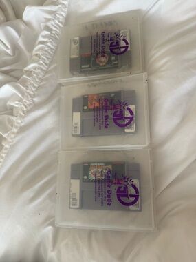 Nintendo Super Nintendo Game Cartridges in Clear Plastic Cases with Purple Logo